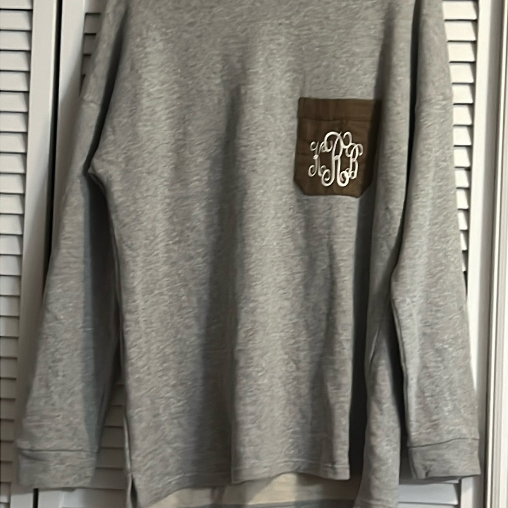 Sweatshirt with KRB initials.